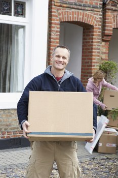 Man and van removals team loading household items in Scotland