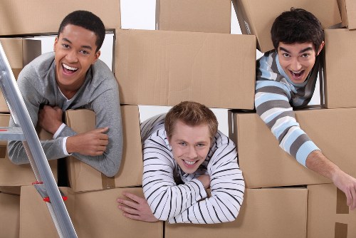 Packed moving boxes and furniture ready for transport in Scotland