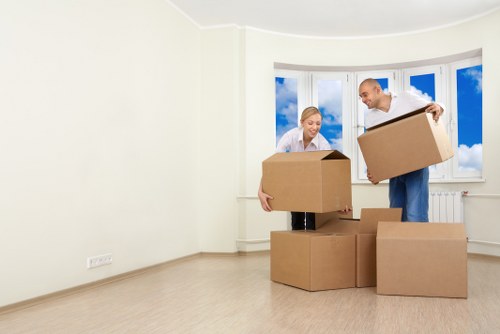 Boxes and furniture being loaded into a moving van in Scotland