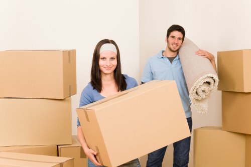 Moving team handling furniture in a Scottish flat
